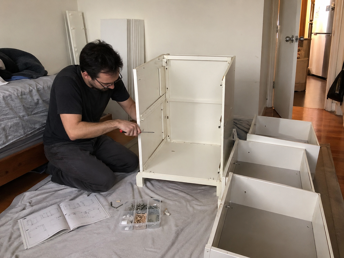 Drawer unit mid-assembly — frame built, drawers being fitted